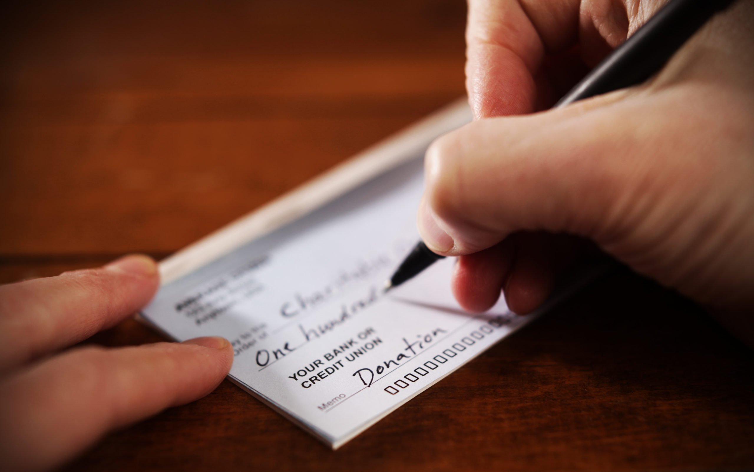 sample image of donation check being written