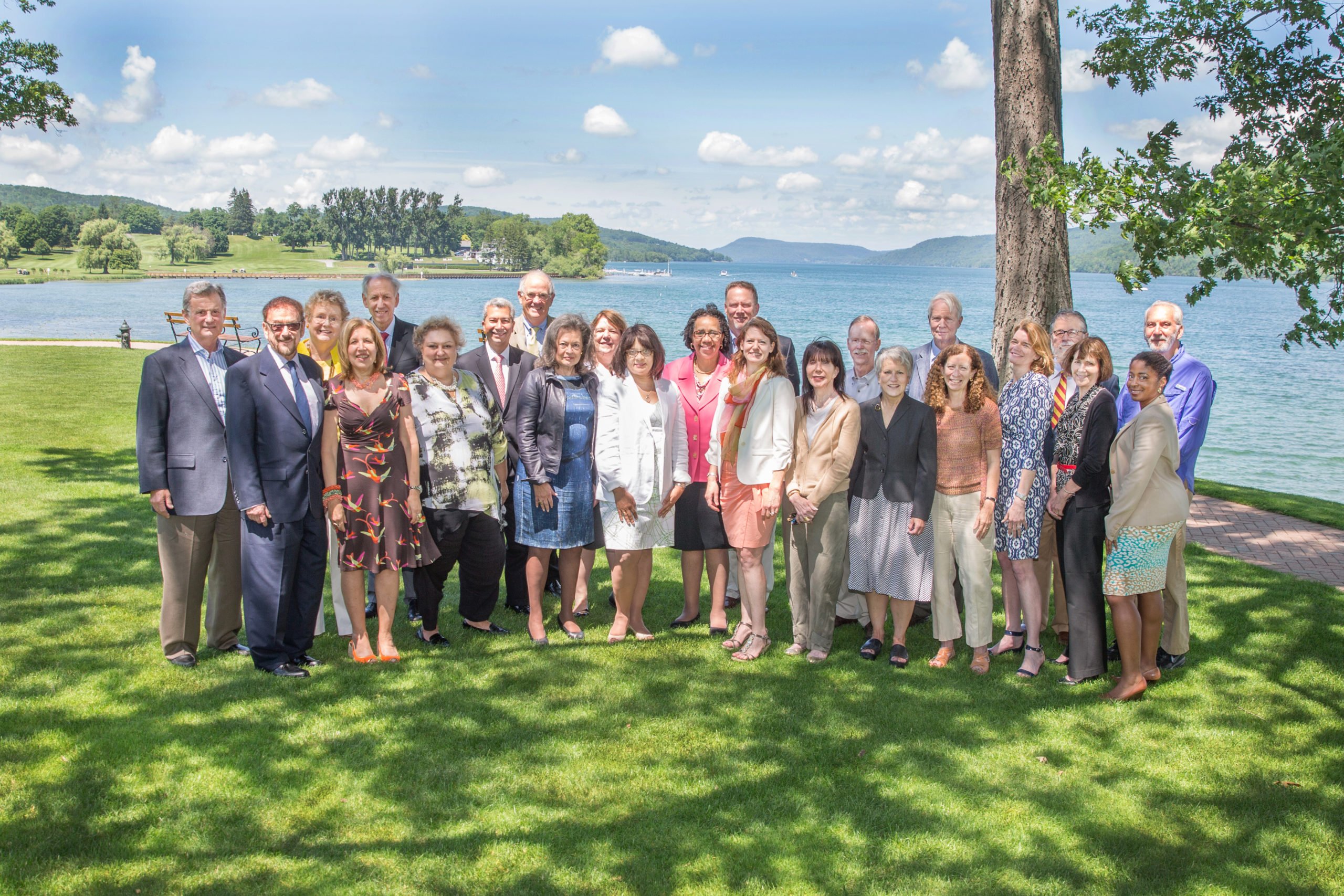 Group photo of Fellows standing in front of Otsego Lake, Cooperstown, New York