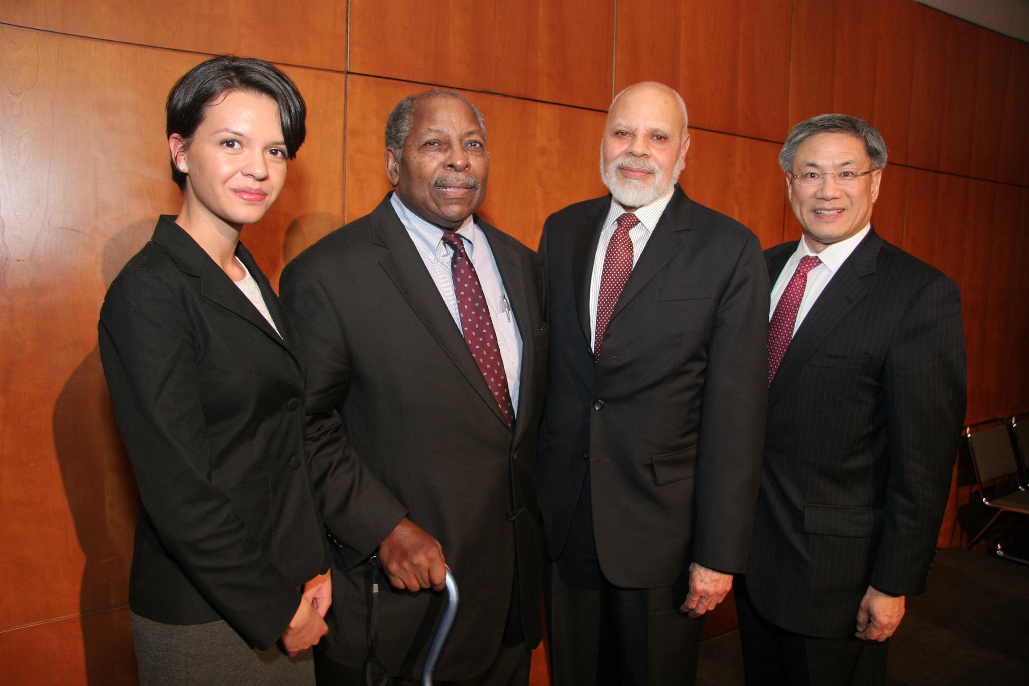 photo of 3 men and 1 woman, prior Corporate Counsel Award recipient